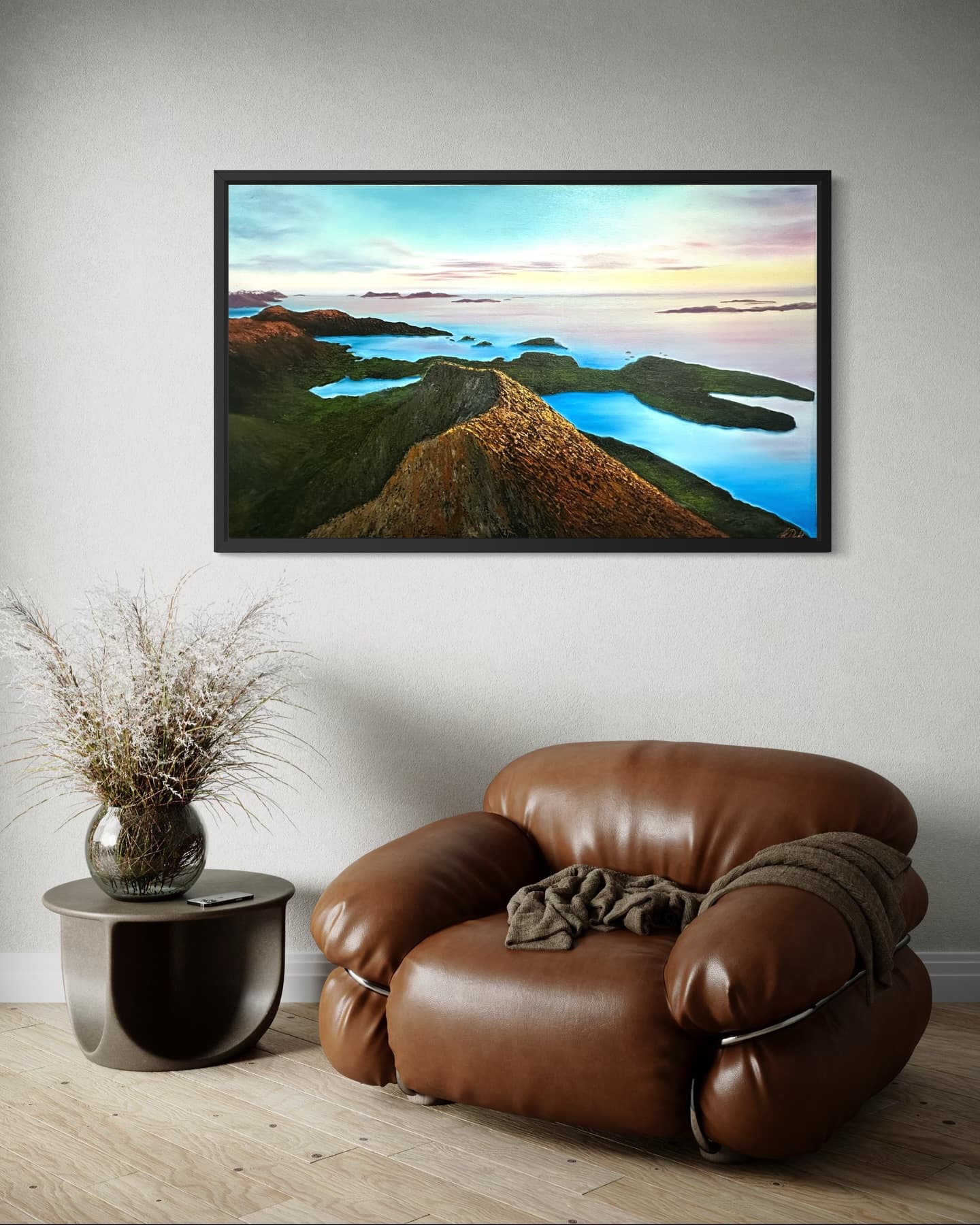“The View from Rørsethornet”: mountain ridge over blue water with islands, above a leather chair.