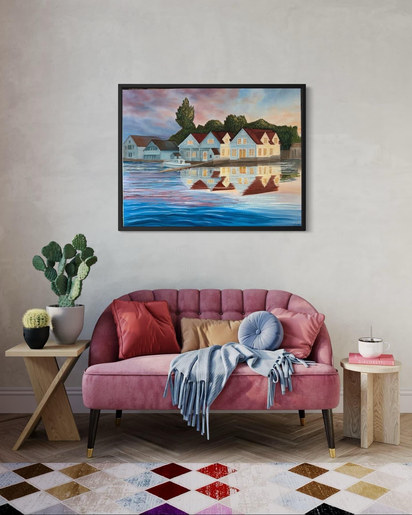 “The Childhood Home” above a rose sofa: houses with red roofs reflected in water.